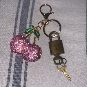 Louis Vuitton lock and key plus unbranded cherry key chain.